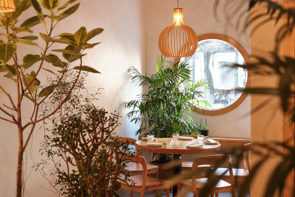 Warm teahouse-inspired dining area at Breeze Greenpoint