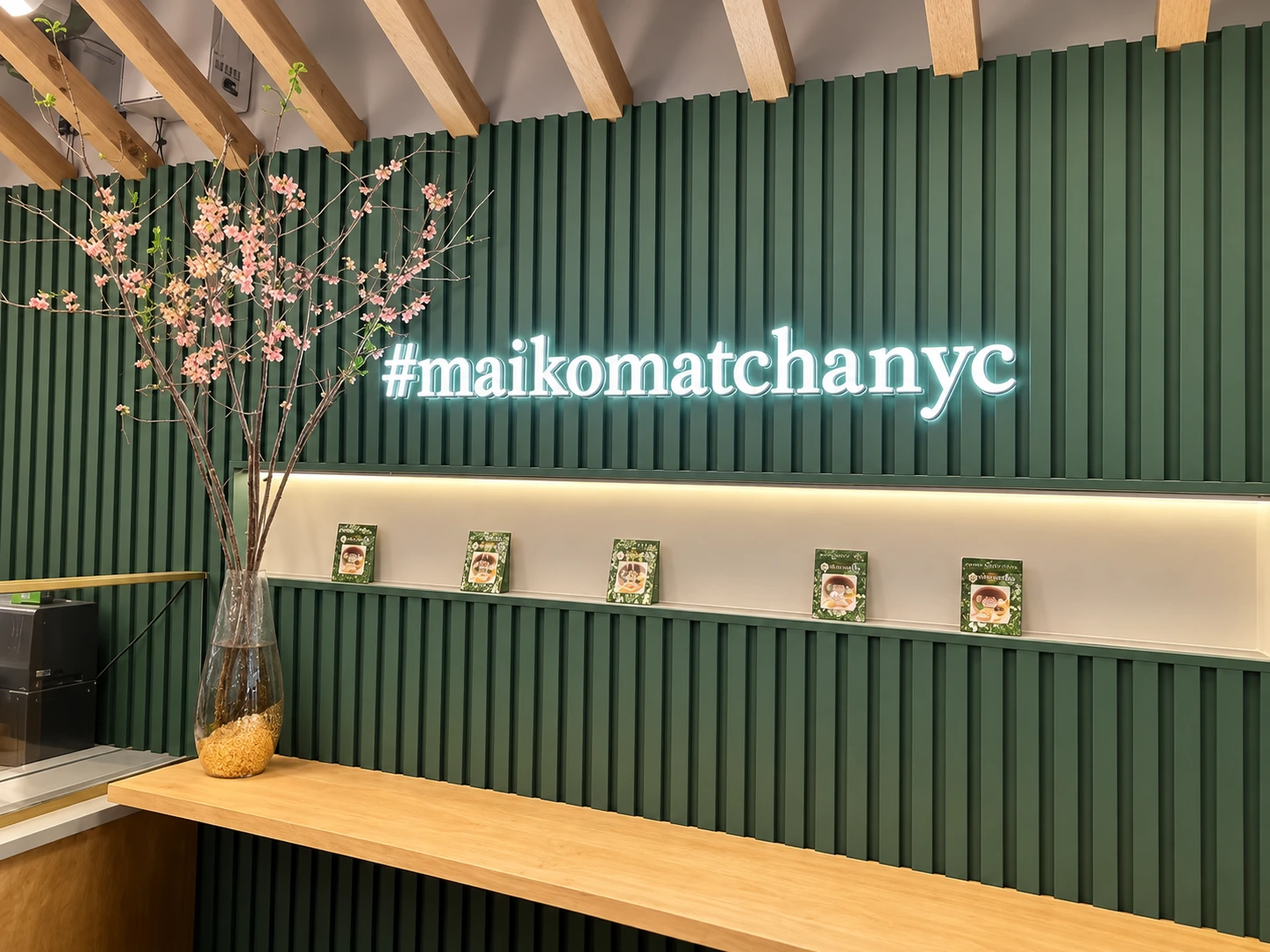Green feature wall at Maiko Matcha Cafe