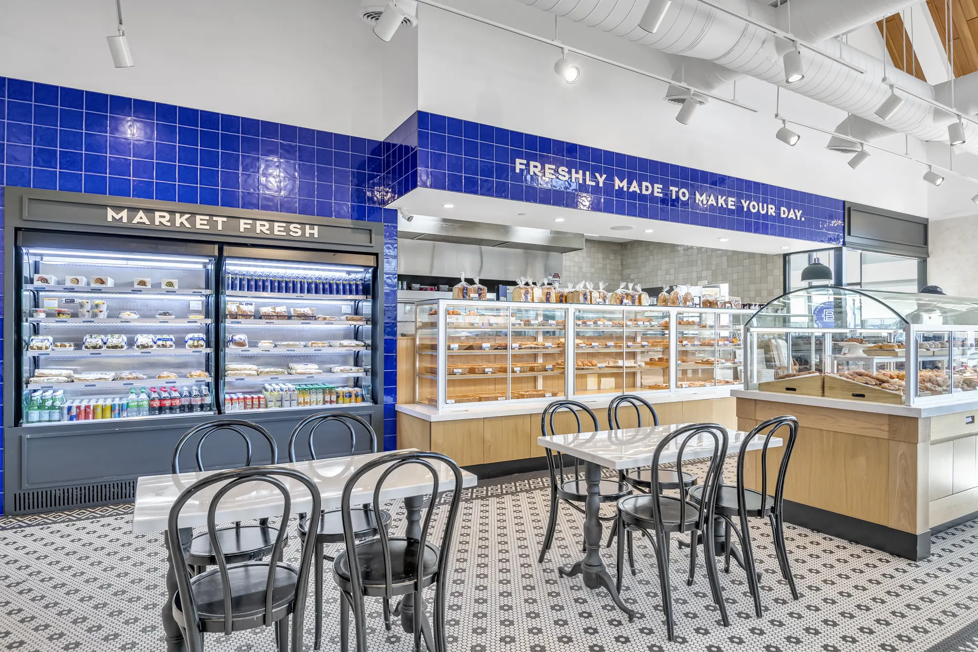 Seating and pastry displays inside Paris Baguette, Huntington Station